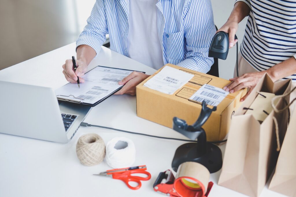 Business owner packing an e-commerce order for TXG fulfillment